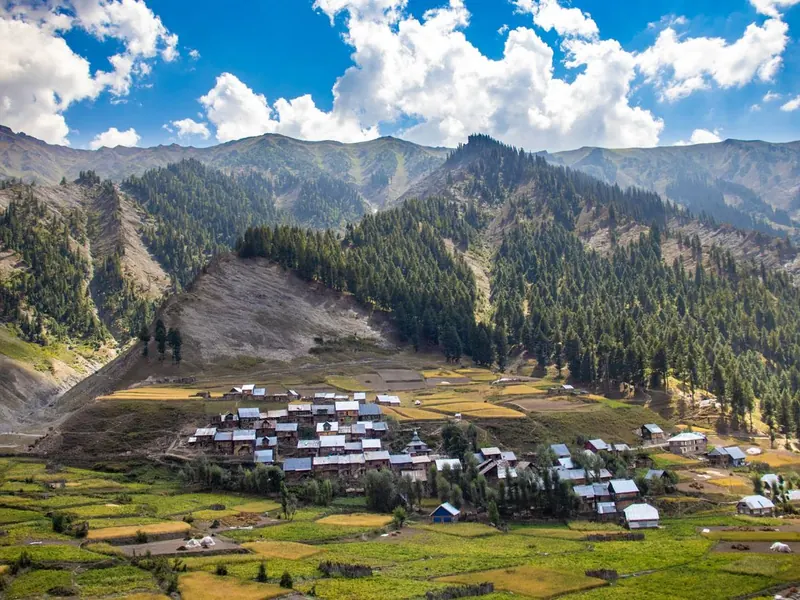 Mountain village in a wide green valley in Kashmir